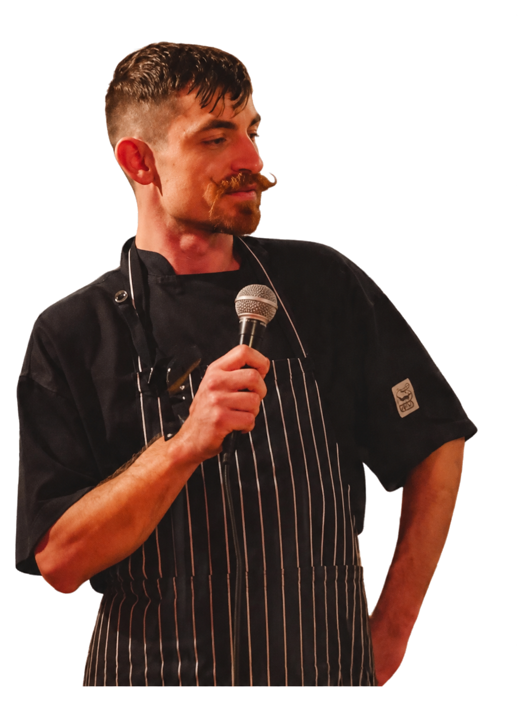 Kris Saccary holding a microphone